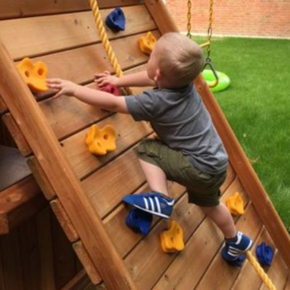 wooden climbing frame with rockwall &amp; swings